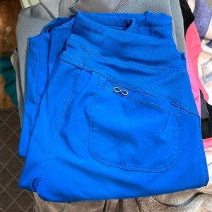 there is a set of scrubs as well as other scrub tops. theyre in great condition.